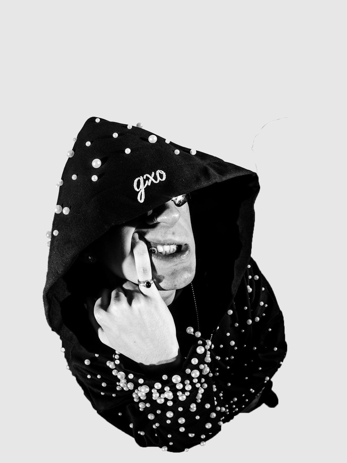 Pearl zip-up with the hood pulled low and a pearl sleeve across the face