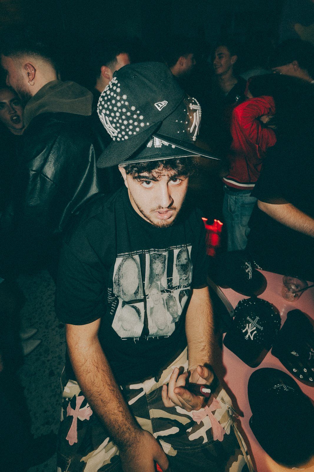 Party guest holding a stack of pearl caps